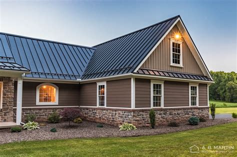 dark grey house with metal roof|gray homes with black roofs.